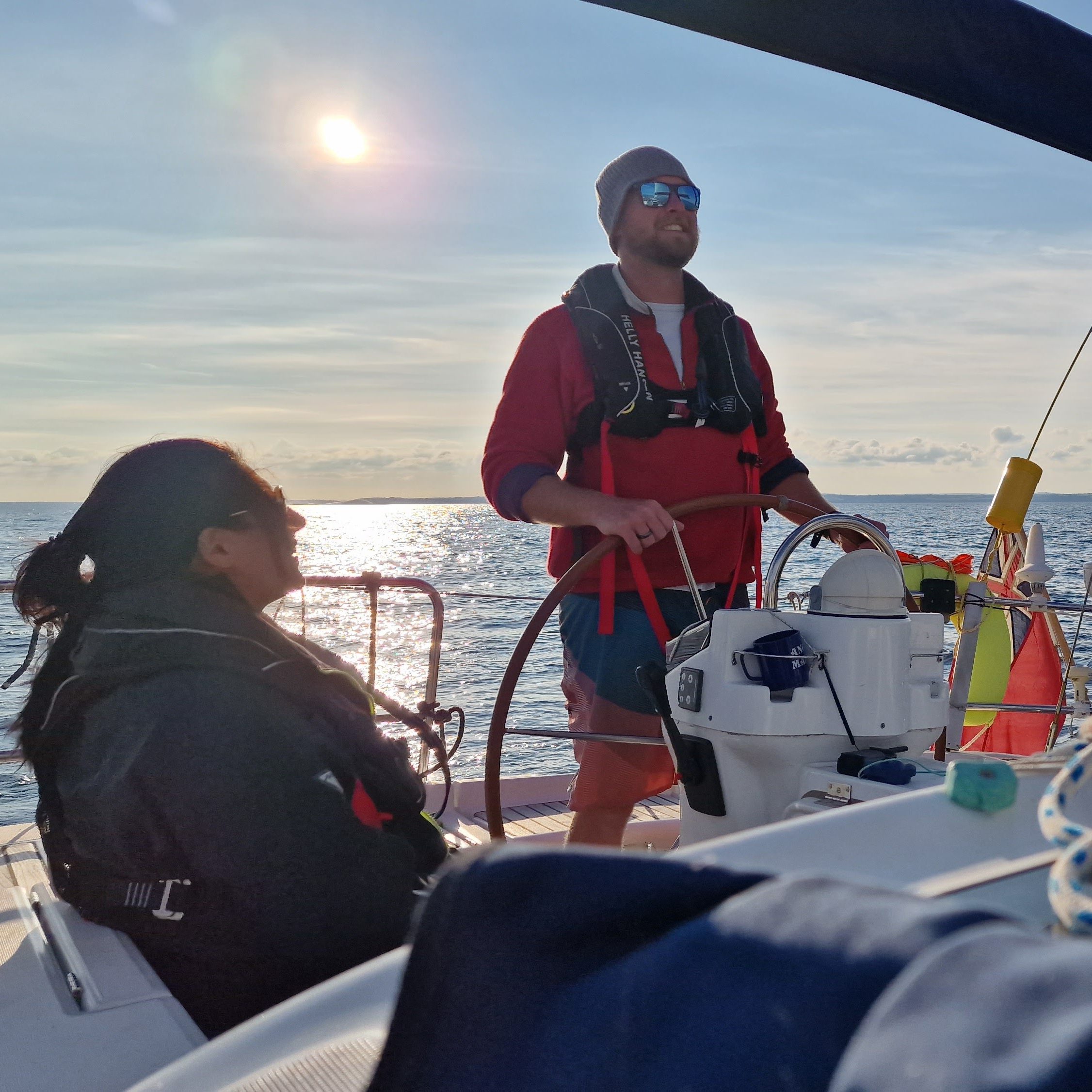 Learning sailing skills aboard a yacht in Cornwall