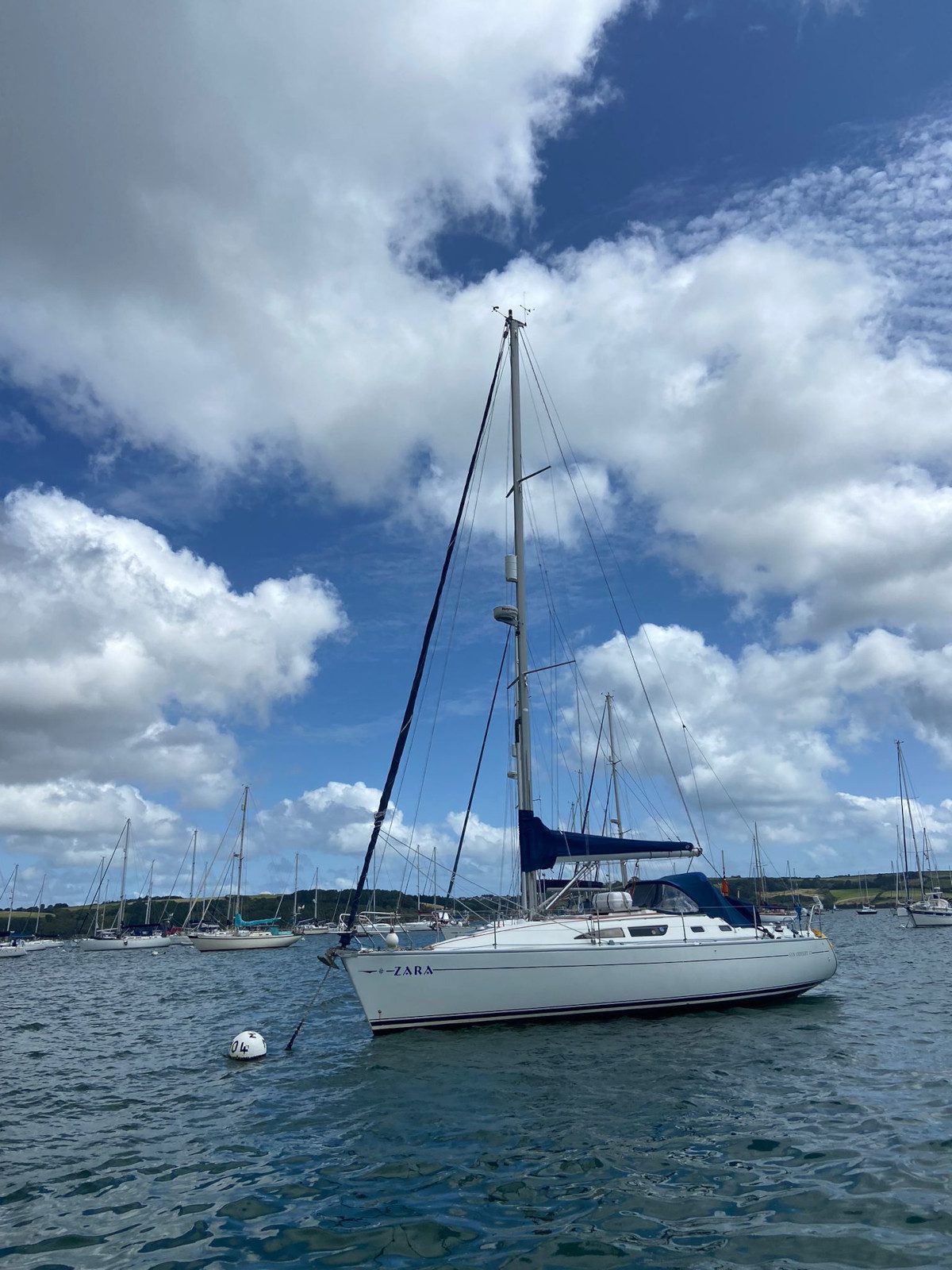 Zara sailing boat at mooring in Mylor harbour